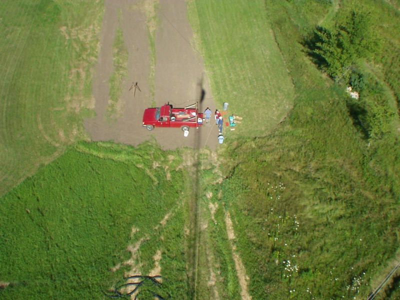Picture of tower crew from above.  Nice shadow of the tower cast upon them.