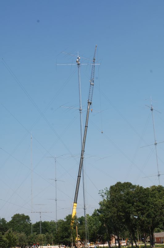 A nice picture of John W2GD and Don K4ZA installing the tall 15  7 ele OWA atop the 20 stack (@199')....