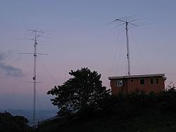 80m dipole is visible hanging between the towers.  Big tower also has 160m sloper facing NE @ 120ft.  NE and SE Beverages are al
